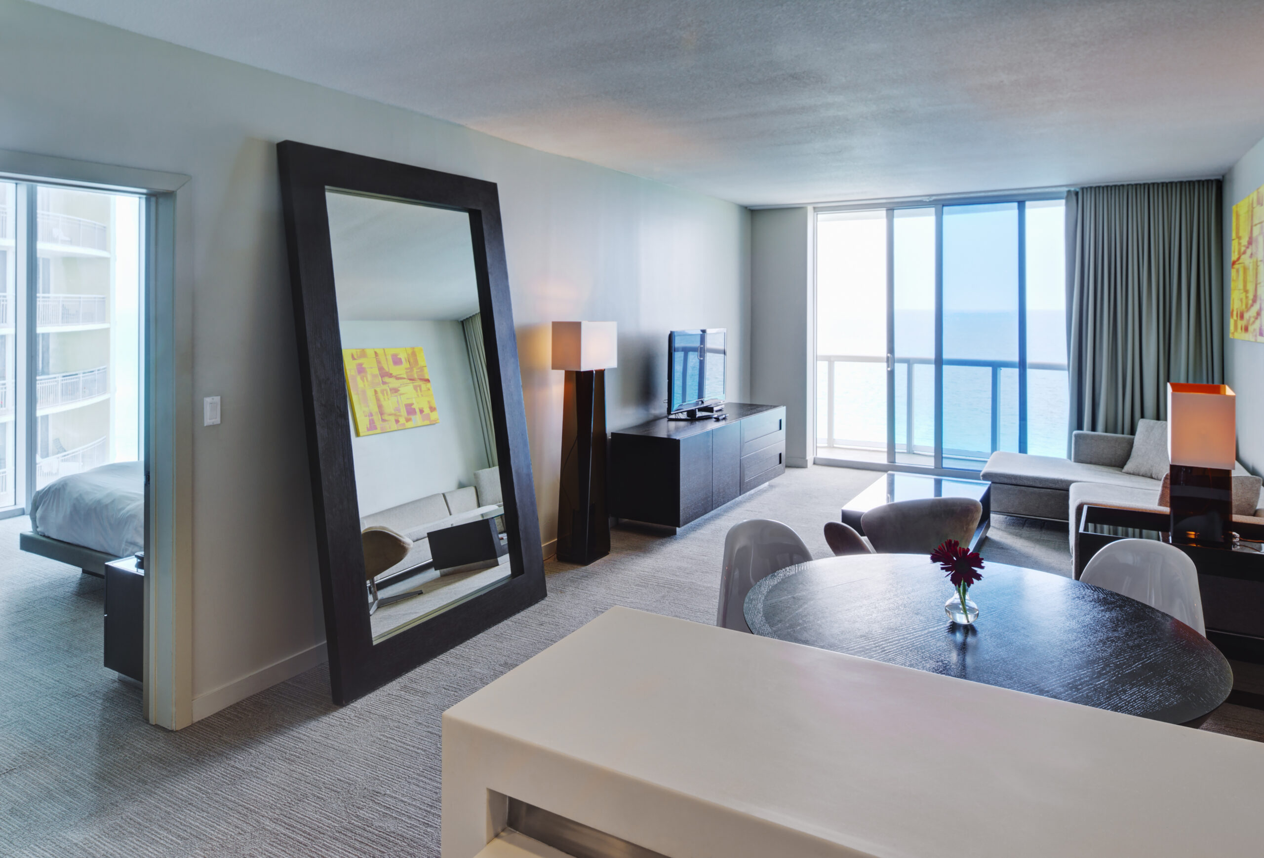 Mirror and lounge area in hotel room